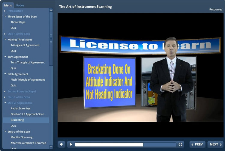 A man in a suit is standing in front of a Rod Machado computer screen, featuring The Art of the Instrument Scan- Interactive eLearning Course.